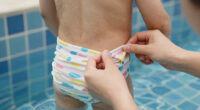 TIL swim diapers let the pee go in the pool, they are actually designed to
